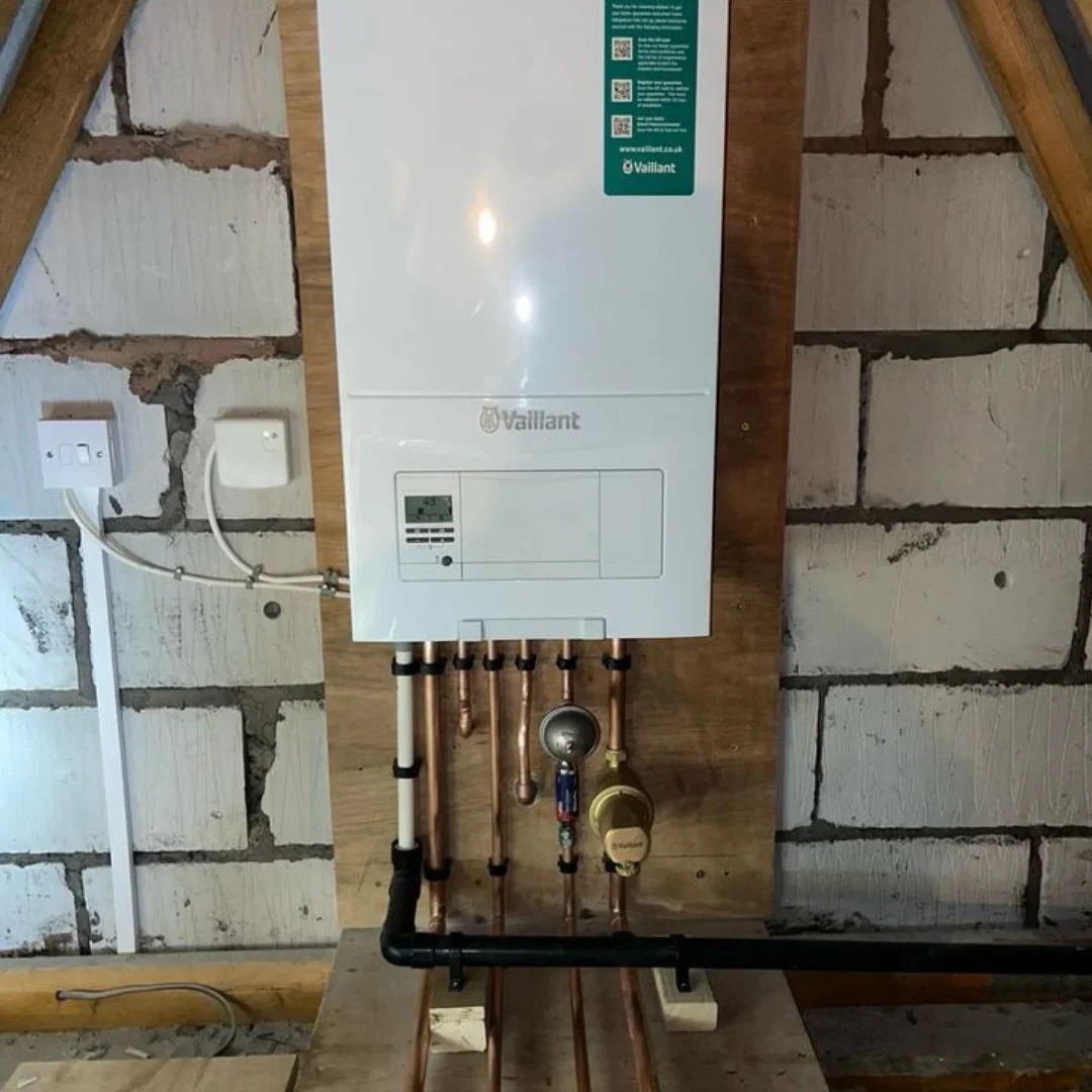 Gas Safe engineer installing a Vaillant boiler